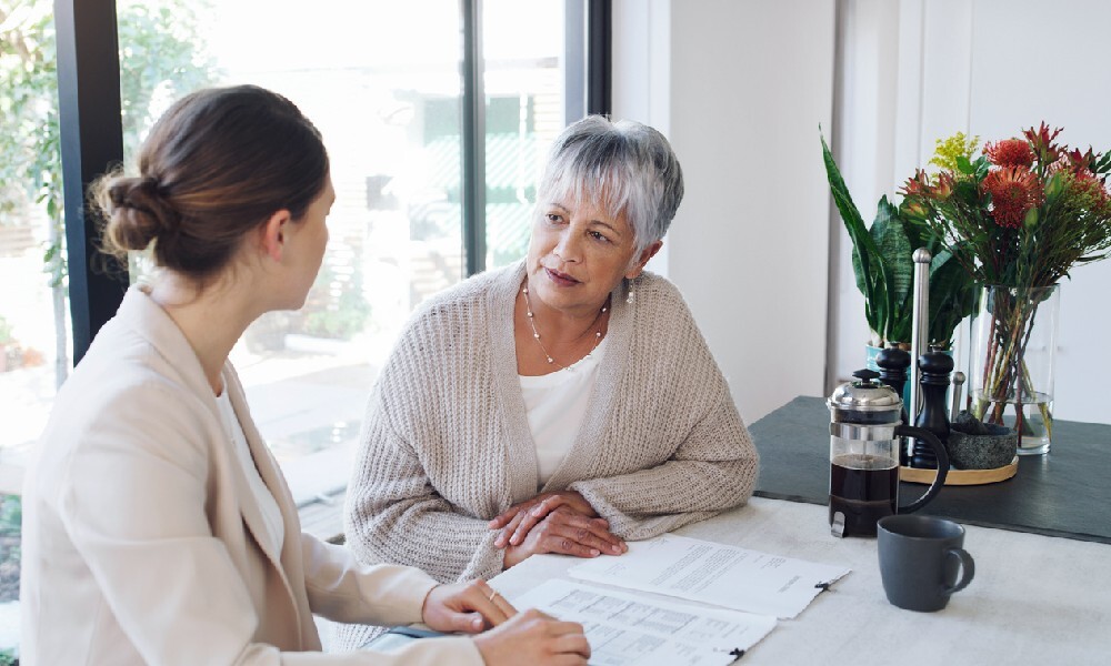 A woman asks about bequests and makes an estate plan with her wealth management advisor.