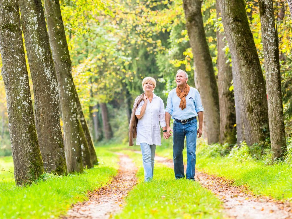 Couple holding hands on a walk
