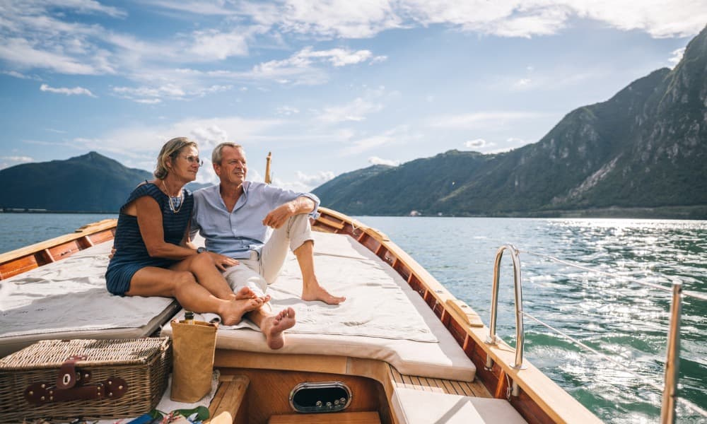 Webinars & Videos - Bogart Wealth Management A couple enjoys life on a boat because they made a budget for retirement when they were younger.