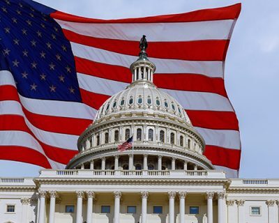 Washington DC Capitol Building on Capitol Hill detail on american flag background USA