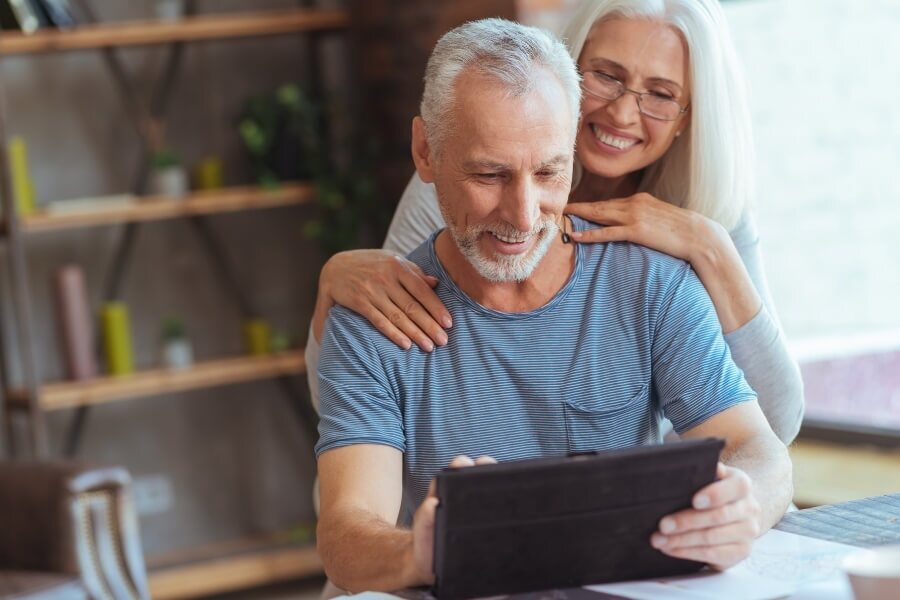 retired couple looking at their retirement plan