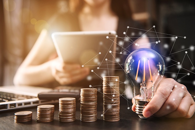 businessman hand holding lightbulb 2023 11 27 05 22 14 utc | Bogart Wealth